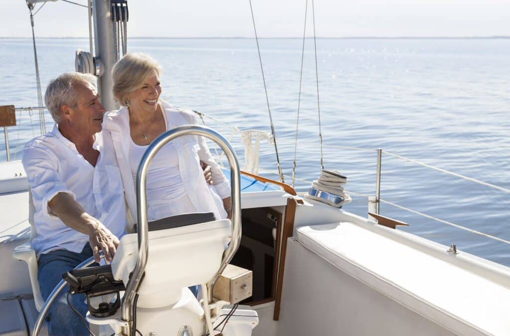 Happy Senior Couple Sailing Yacht or Sail Boat