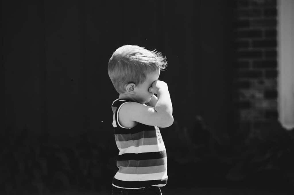 Child rubbing his eyes