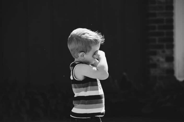 Child rubbing his eyes